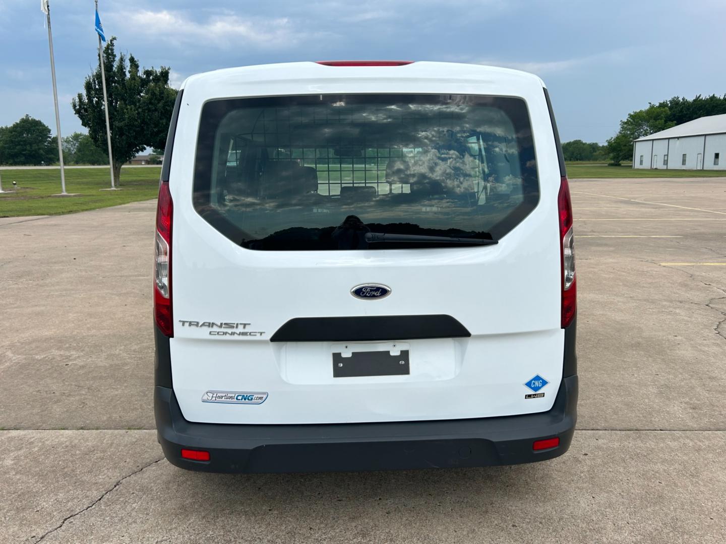 2014 White /Gray Ford Transit Connect Wagon XL w/Rear Liftgate LWB (NM0GE9E75E1) with an 2.5L L4 DOHC 16V engine, 6-Speed Automatic transmission, located at 17760 Hwy 62, Morris, OK, 74445, (918) 733-4887, 35.609104, -95.877060 - 2014 FORD TRANSIT CONNECT HAS 2.5L ENGINE, FEATURES POWER LOCKS, POWER WINDOWS, POWER MIRRORS, AM/FM STEREO, CRUISE CONTROL, BLUETOOTH HANDS-FREE CALLING, BACKSEAT,IT RUNS ON CNG (COMPRESSED NATURAL GAS) OR GASOLINE. A PREMIER ALTERNATIVE FUEL CONVERSION THAT IS EPA-APPROVED. EXTREMELY CLEAN-BURNING - Photo#5